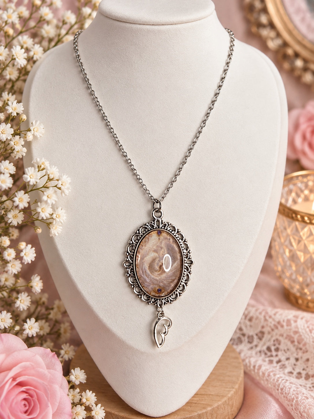 Aureole Keepsake angelcore necklace with ornate silver pendant and wing charm