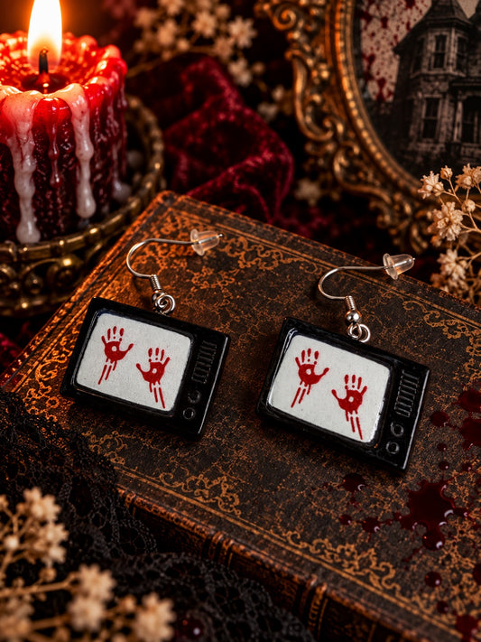 Black vintage television earrings with red bloody handprints on the screens.