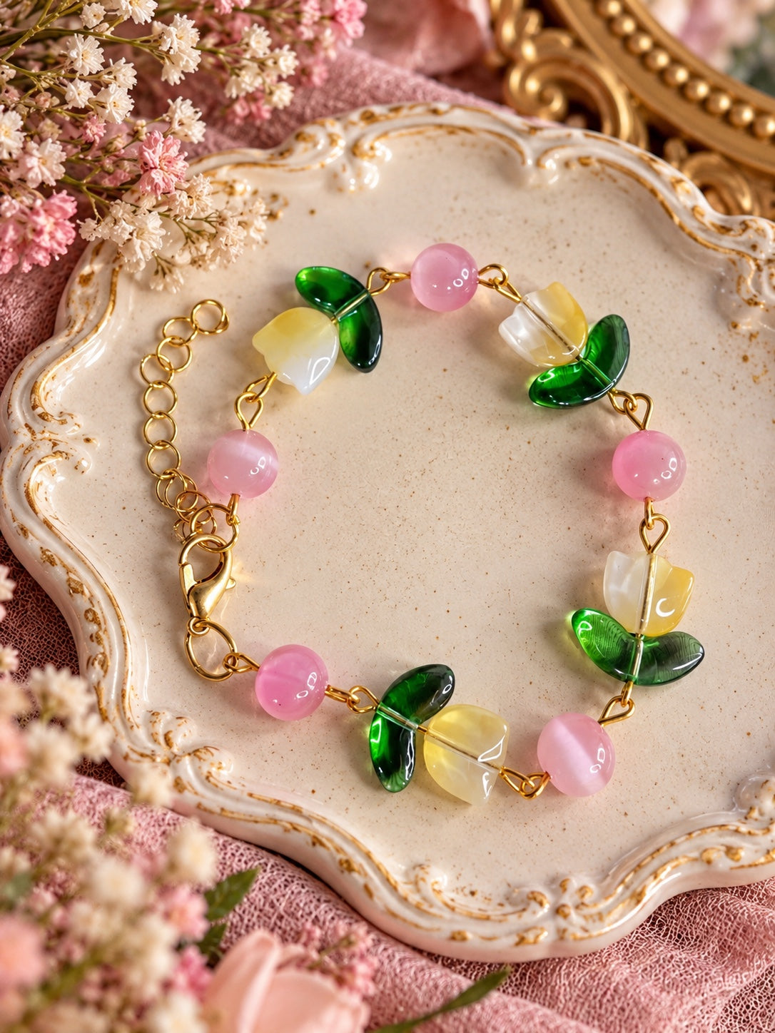 Blushpetal Tulip Bracelet with yellow and white tulip beads, green leaves, pink round beads and gold-tone links