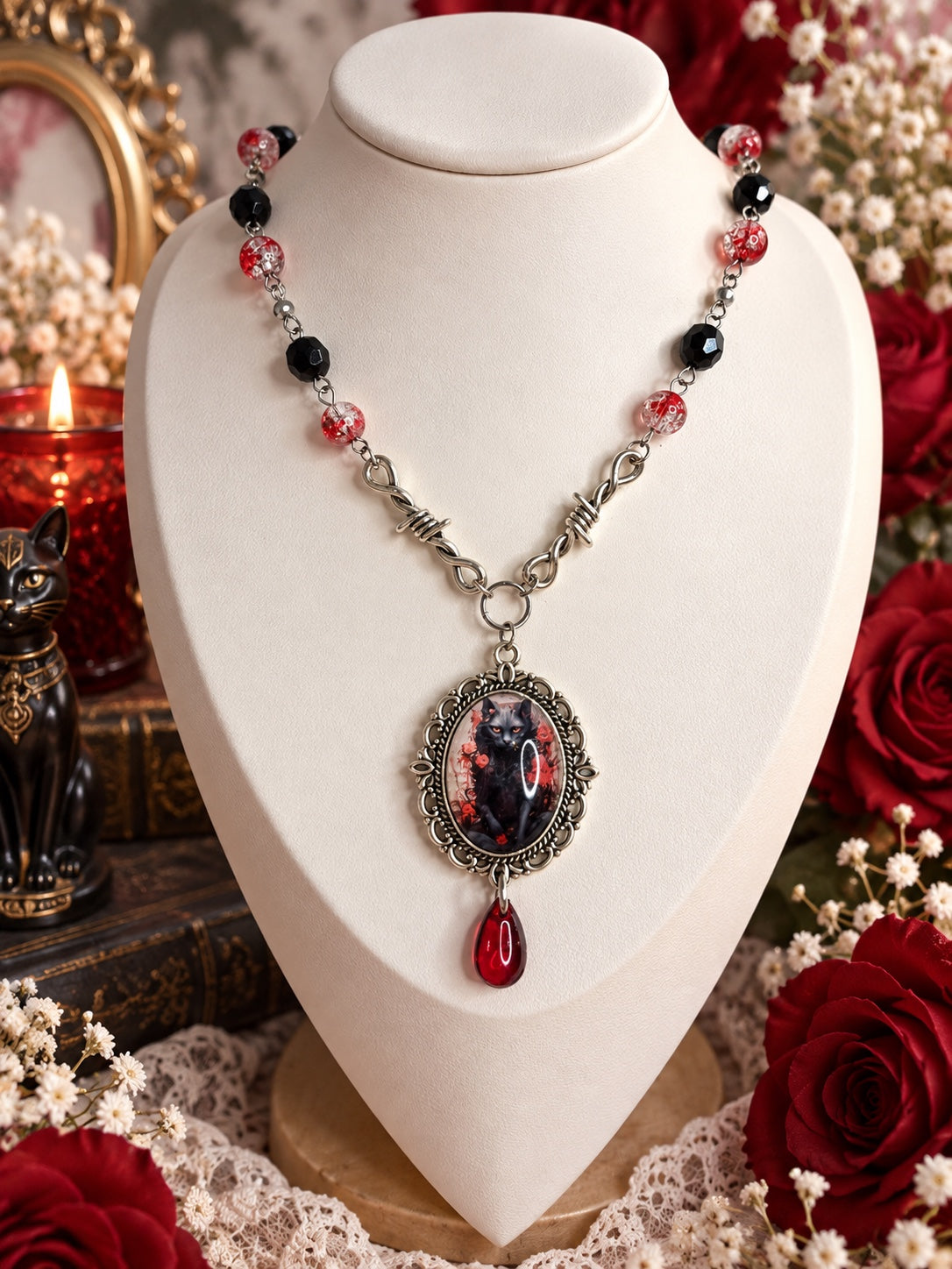 Gothic black cat cameo necklace with red and black beads, silver-tone barbed wire connectors and a red teardrop