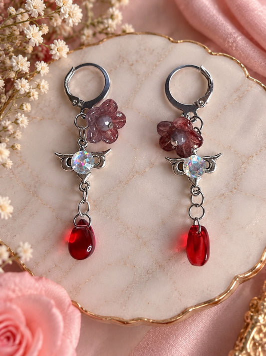 Silver-tone earrings with dusky floral beads, iridescent accents and red teardrops