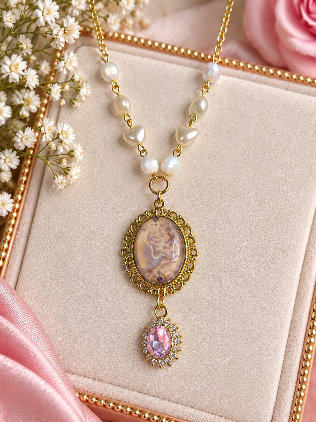 Celestine Pearlheart angelcore necklace with gold-tone chain, pearl hearts and pink crystal pendant