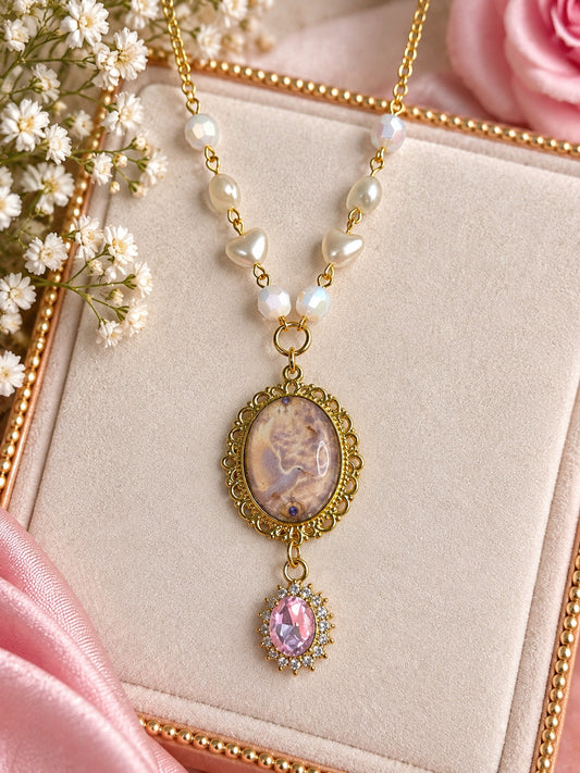 Celestine Pearlheart angelcore necklace with gold-tone chain, pearl hearts and pink crystal pendant