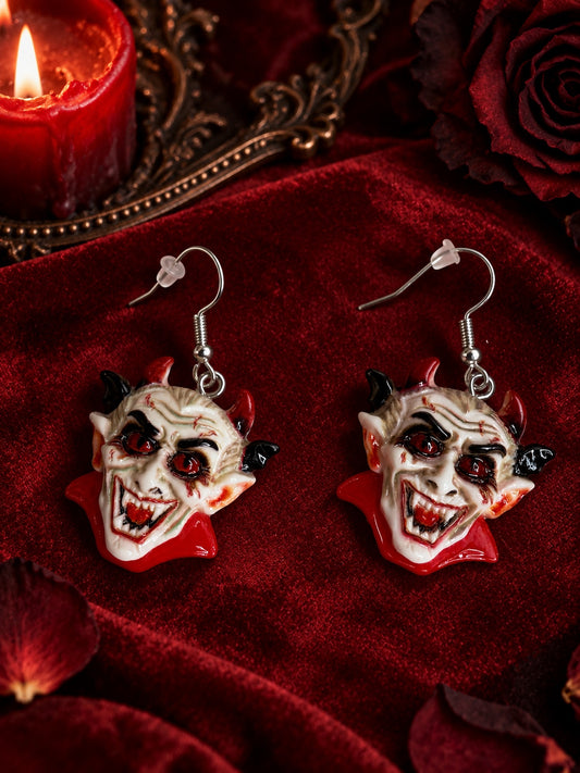 Creepy red and black devil face earrings with silver-tone fishhooks.