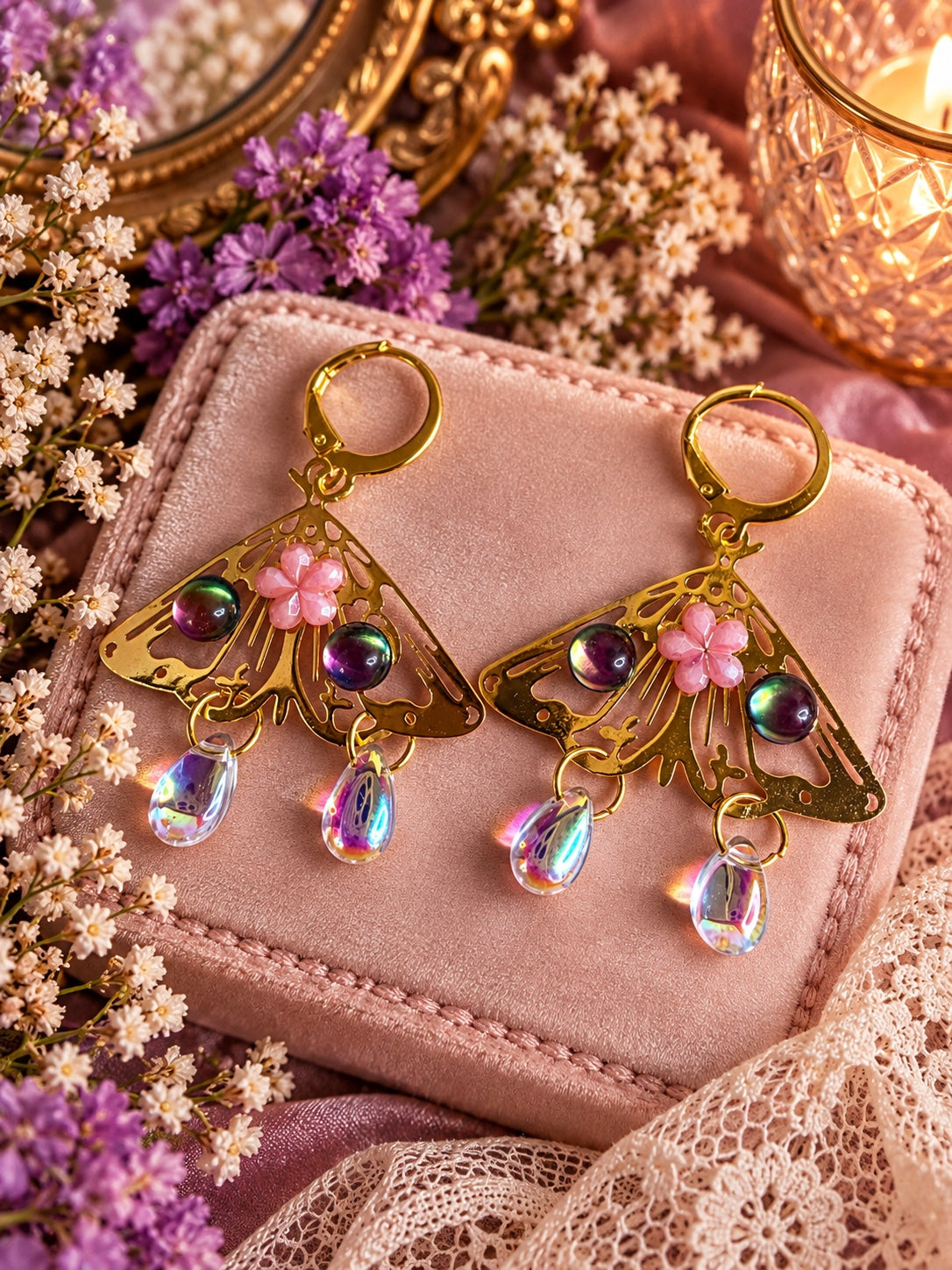 Handmade gold moth earrings with pink flowers, iridescent beads and crystal drops
