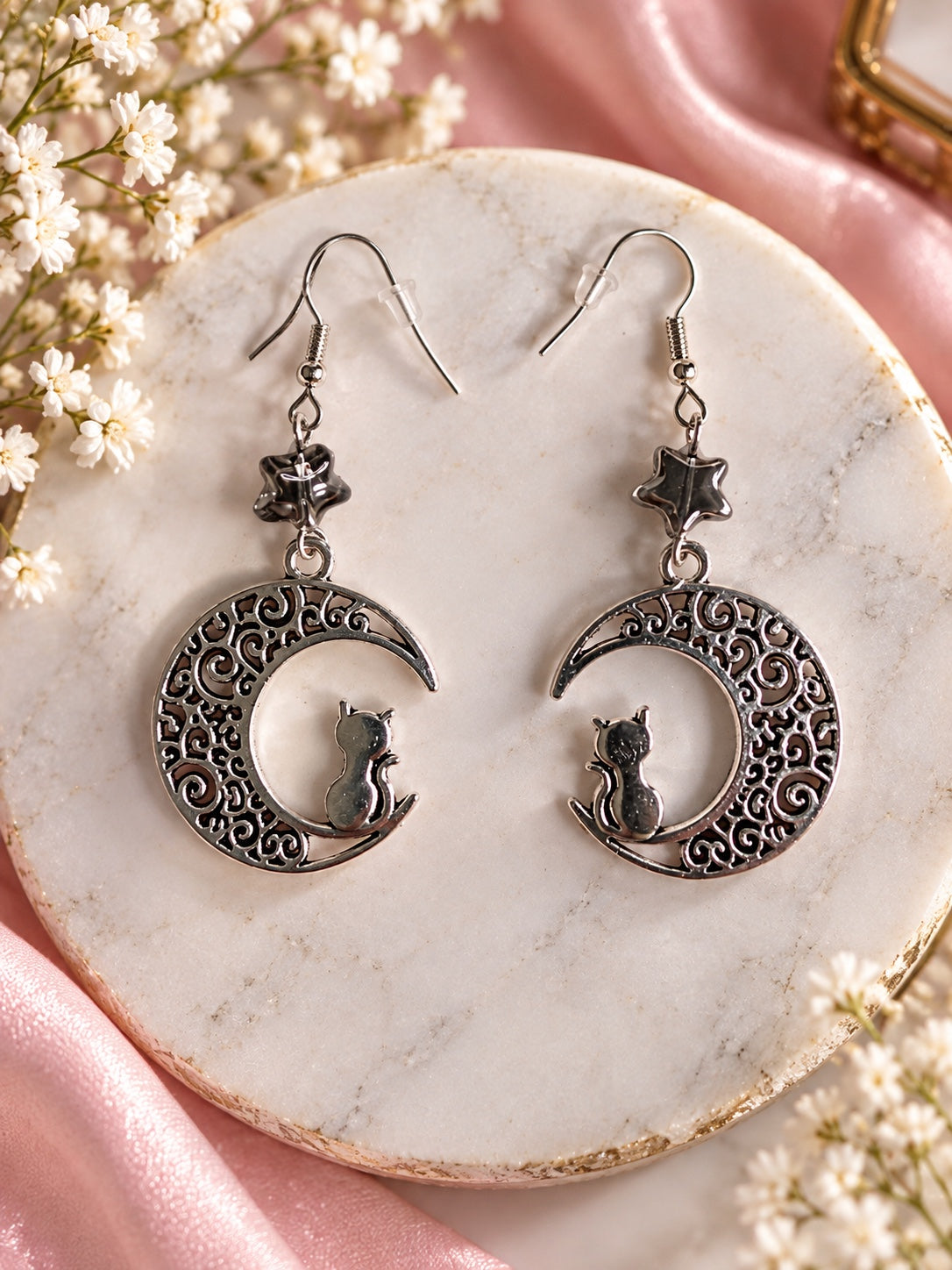 Silver-tone crescent moon and cat earrings with dark star beads