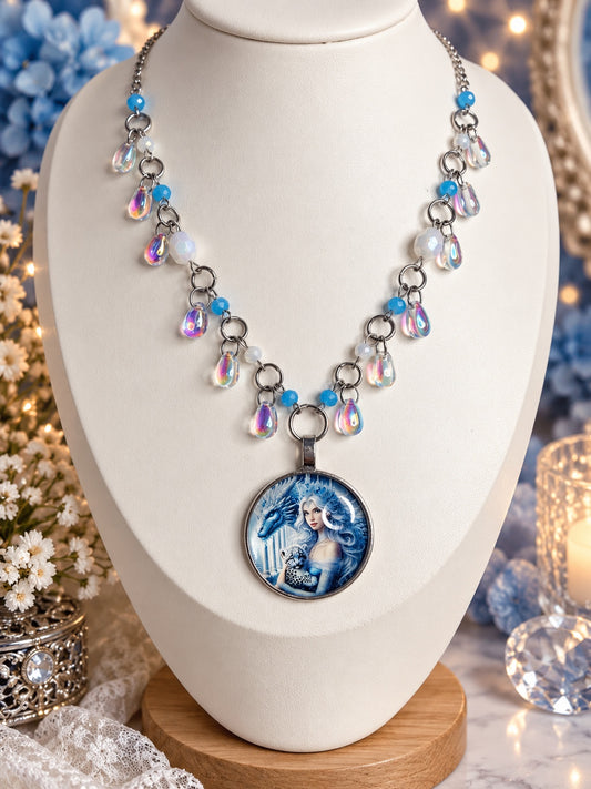 Silver-tone necklace with blue and white beads, iridescent teardrops and a round ice queen and dragon cameo