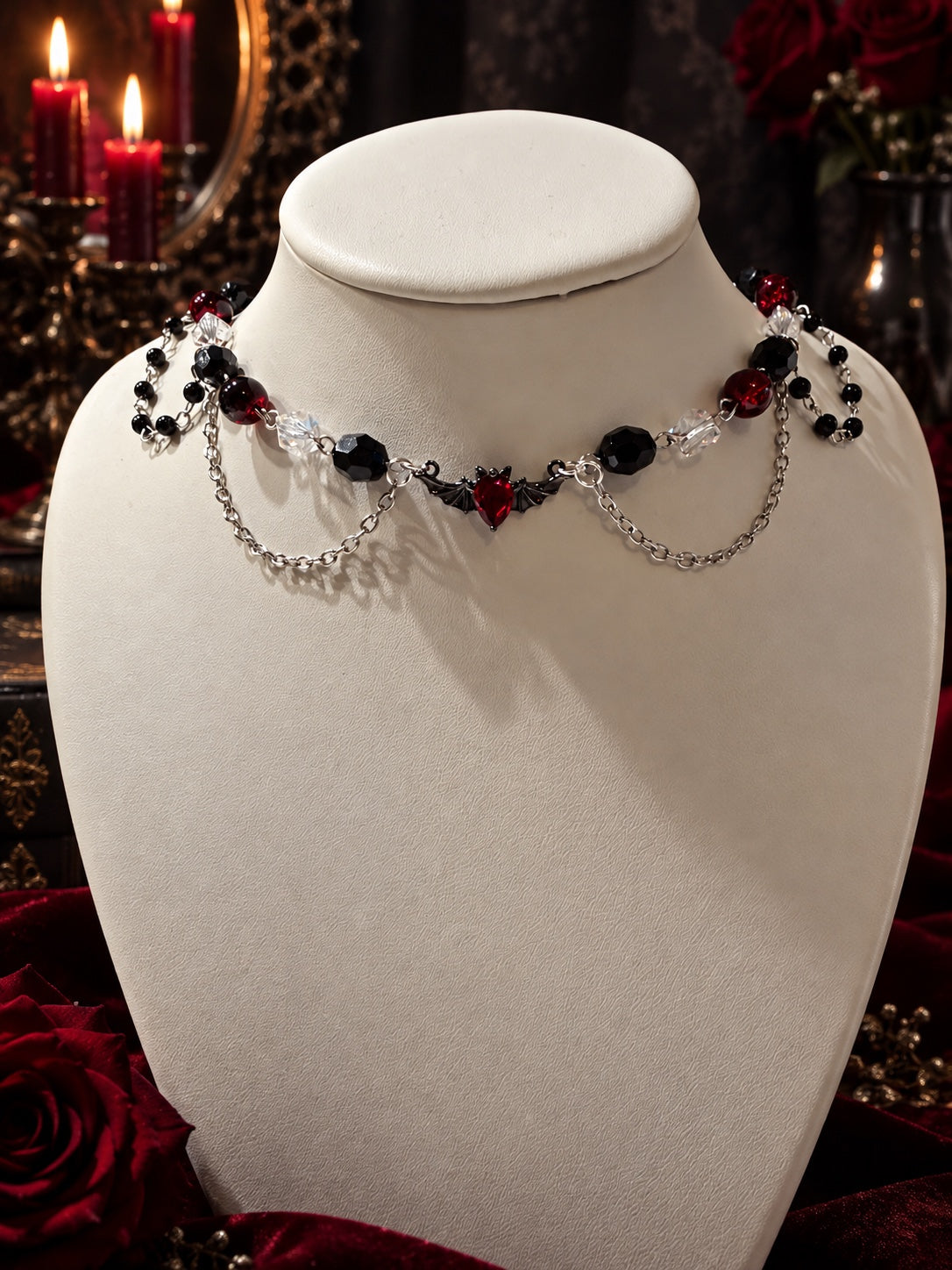 Handmade gothic necklace with red, black and clear beads, silver-tone chains and a red bat centerpiece