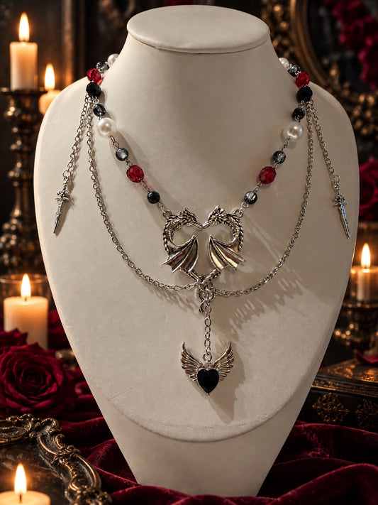 Handmade gothic medieval layered necklace with silver dragons, swords, red black and pearl beads, and black winged heart pendant