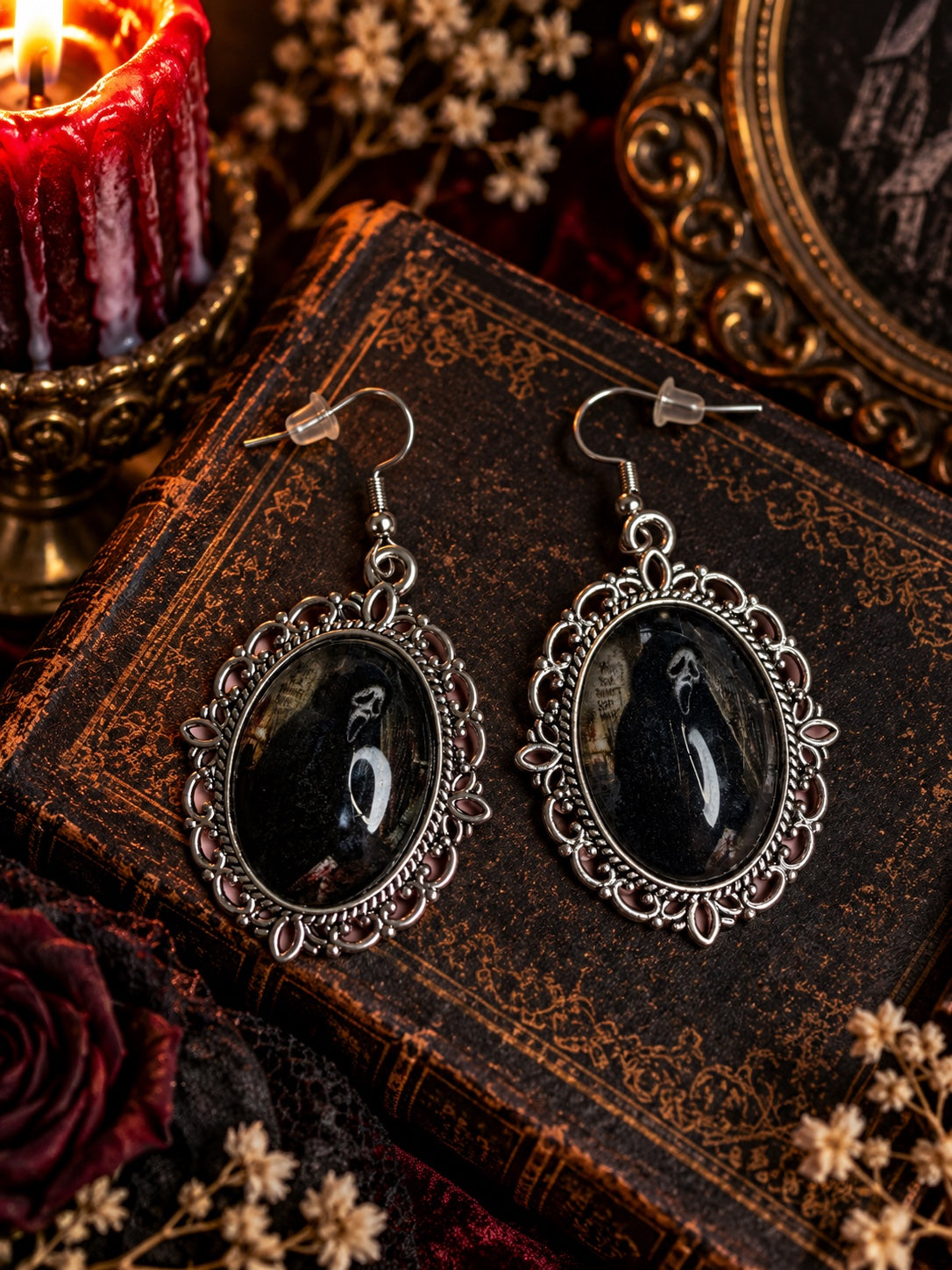 Ghostface portrait earrings in ornate silver-tone oval frames with French hooks