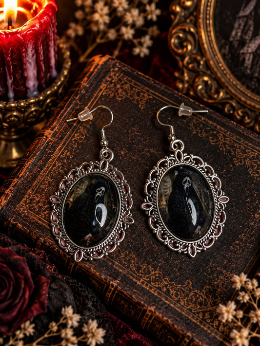 Ghostface portrait earrings in ornate silver-tone oval frames with French hooks