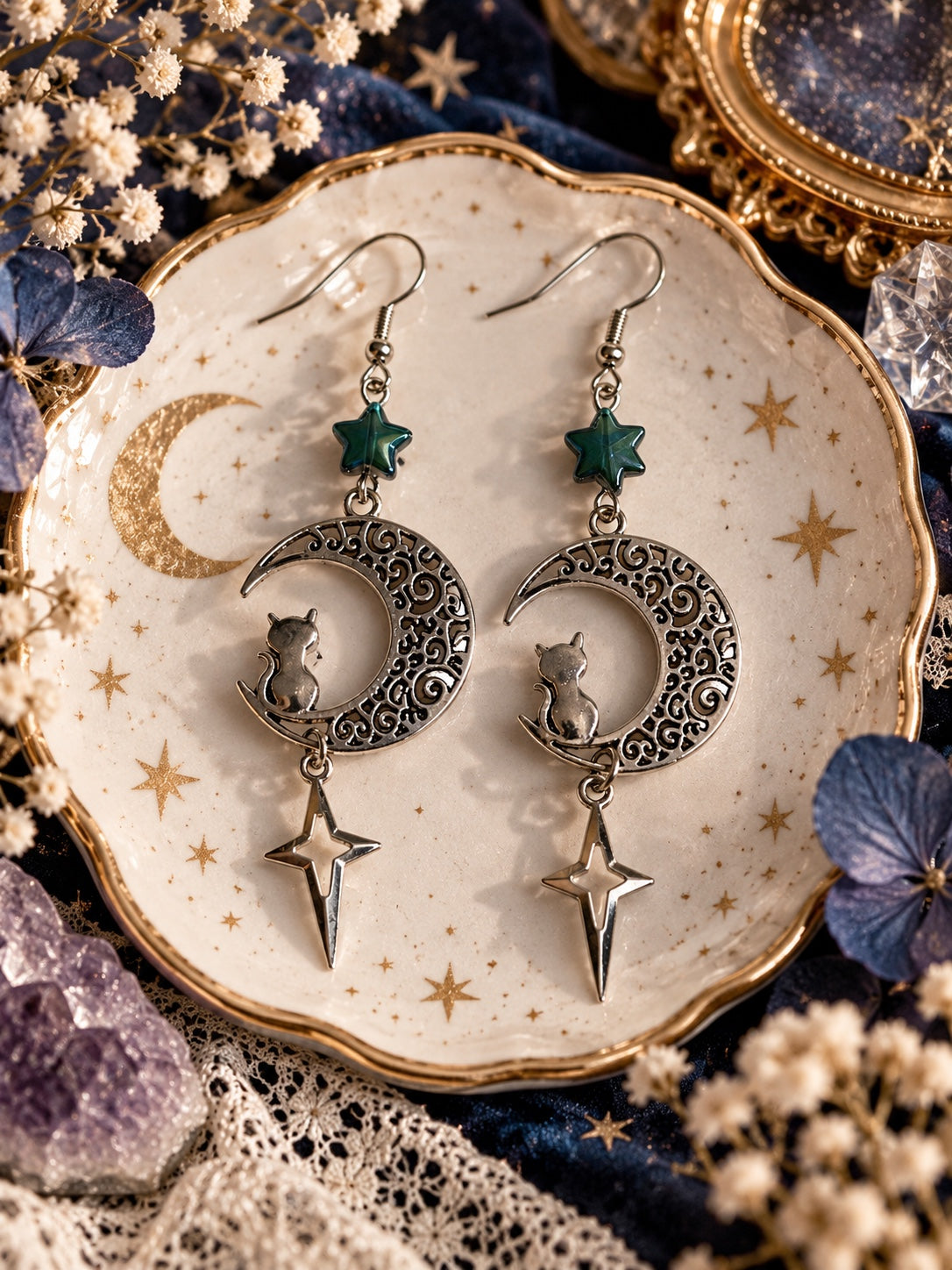 Silver-tone filigree crescent moon earrings with seated cats, teal star beads and elongated dangling stars