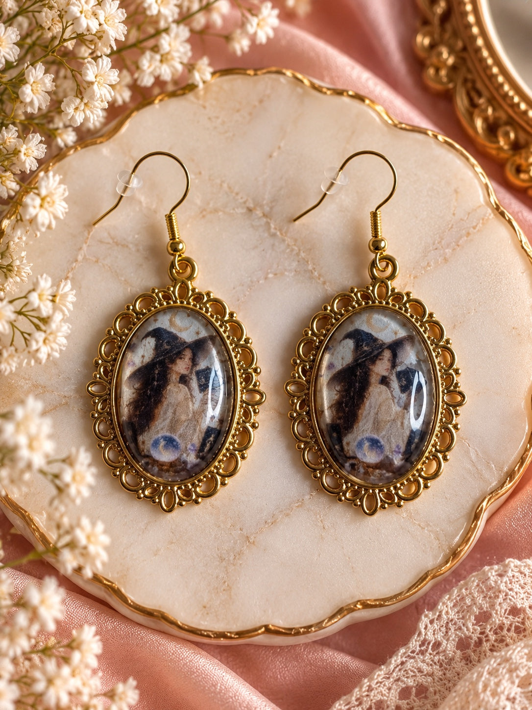 Gold-tone vintage witch portrait earrings with ornate oval frames