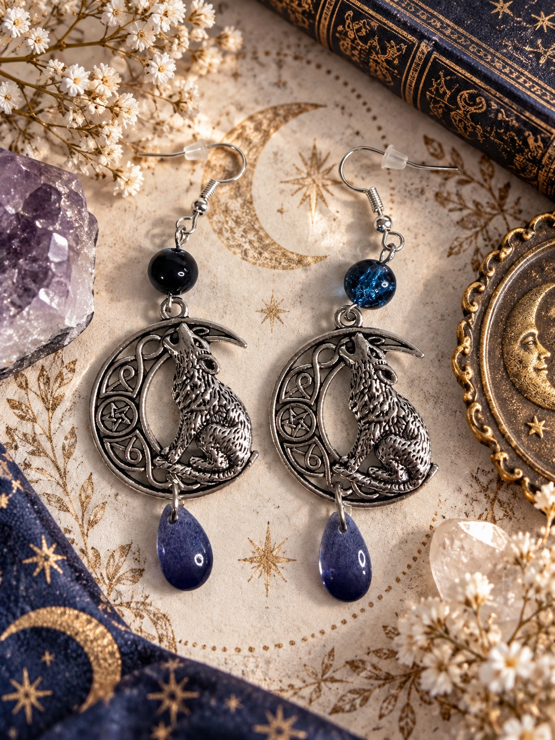 Silver-tone howling wolf crescent moon earrings with dark blue beads and violet teardrop charms