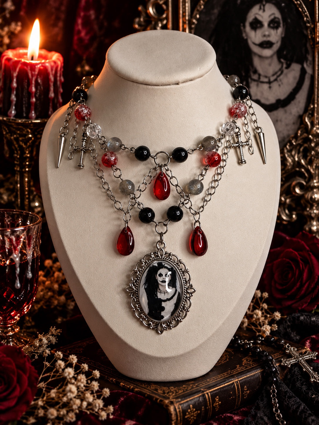 Portrait of a Nightmare necklace featuring Patricia Braham's horror cosplay portrait, layered silver-tone chains, red teardrops, black and grey beads, crosses and spikes.