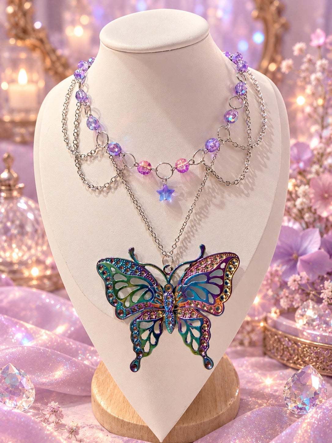 Handmade fairycore and dark fairycore statement necklace with purple and pink beads, layered silver-tone chains, star charm and large multicolor butterfly pendant