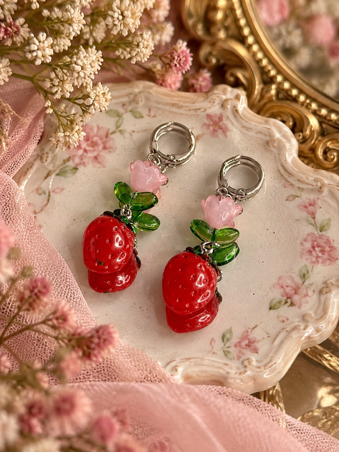 Strawberry Blossom Earrings with red strawberries, pink flowers, translucent green leaves and silver-tone hinged hoops