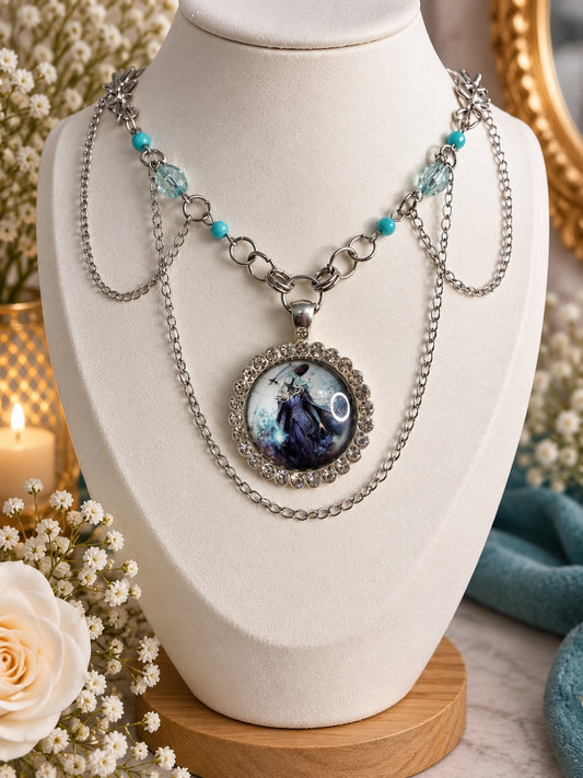 Layered silver-tone witch cameo necklace with turquoise-coloured beads, pale blue faceted beads and a sparkling round pendant