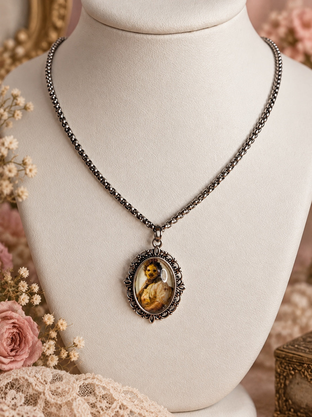 Silver-tone chain necklace with an ornate oval frame and a sepia-toned horror portrait pendant.