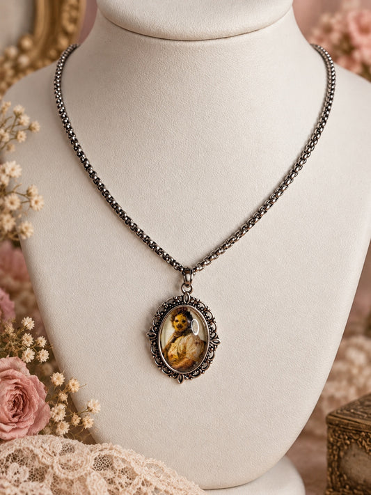 Silver-tone chain necklace with an ornate oval frame and a sepia-toned horror portrait pendant.
