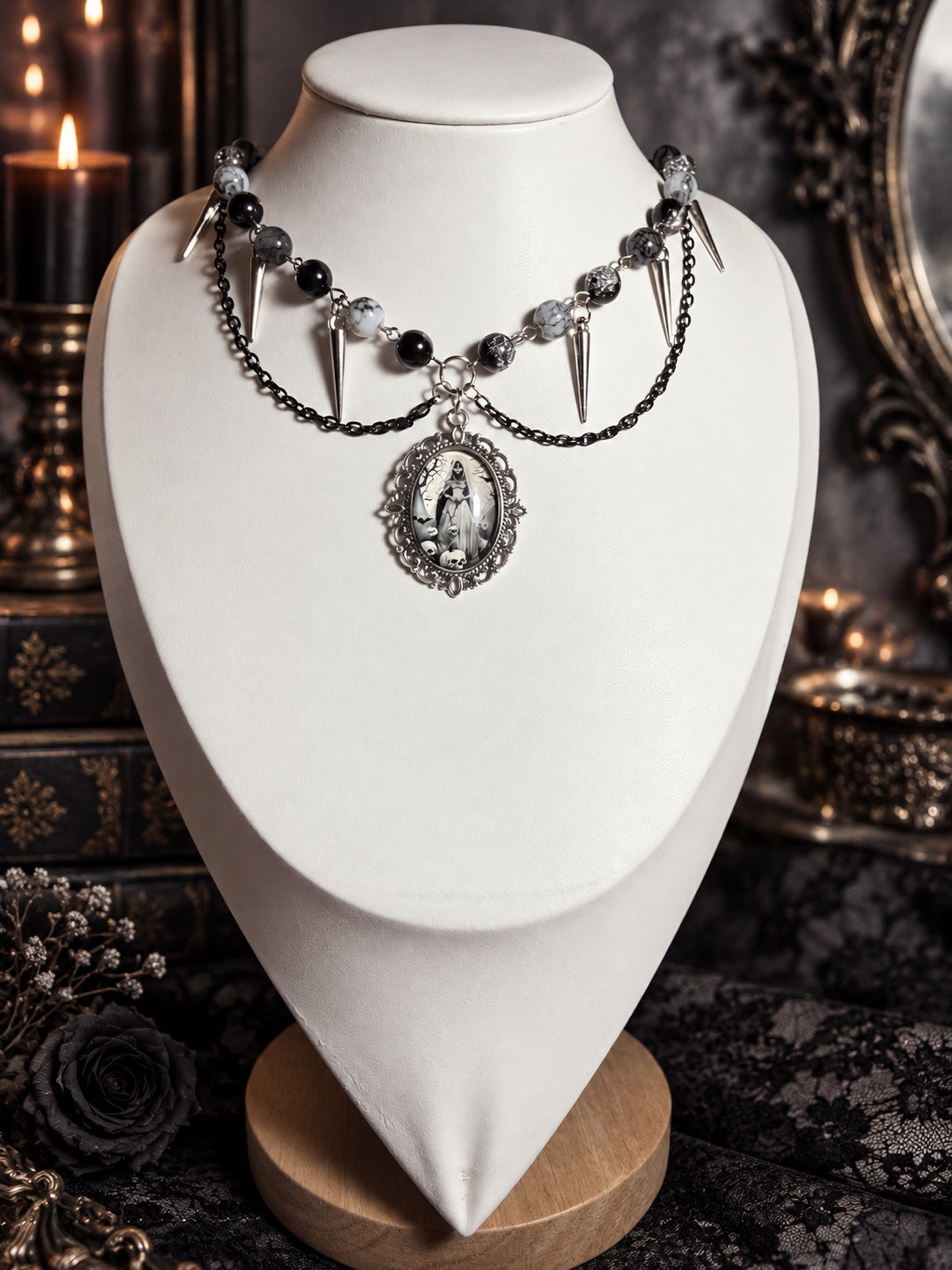 The Mourning Hour necklace with black draped chains, monochrome beads, silver-tone spike charms and an ornate skeletal figure cameo.