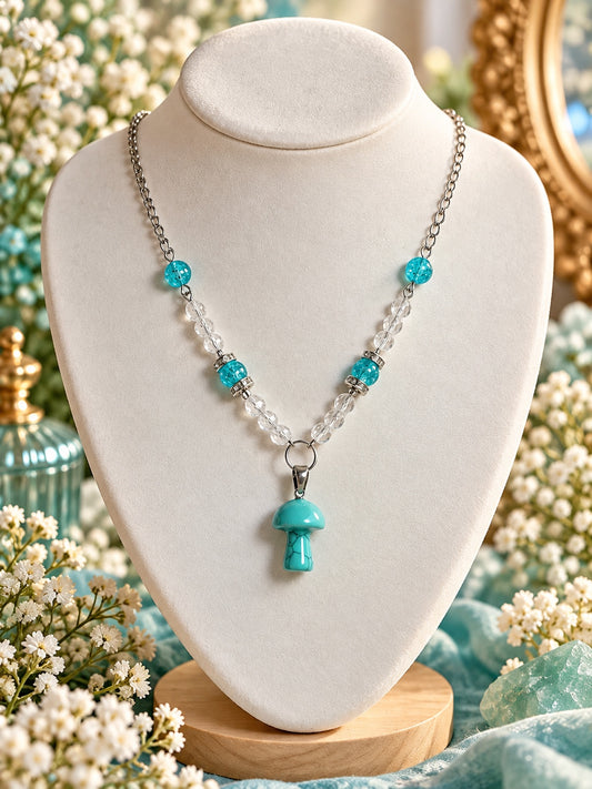 Silver-tone necklace with clear and aqua beads, sparkling spacers and a turquoise-coloured mushroom pendant.
