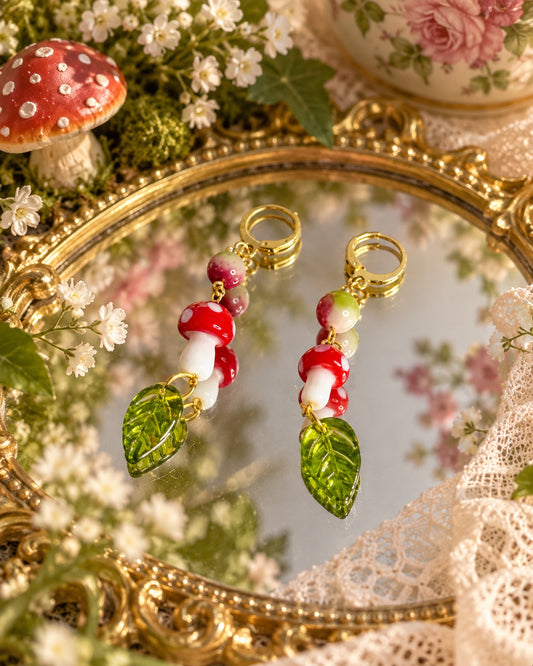 Toadstool Leaf Earrings with red and white mushrooms, translucent green leaves, multicolour beads and gold-tone hinged hoops