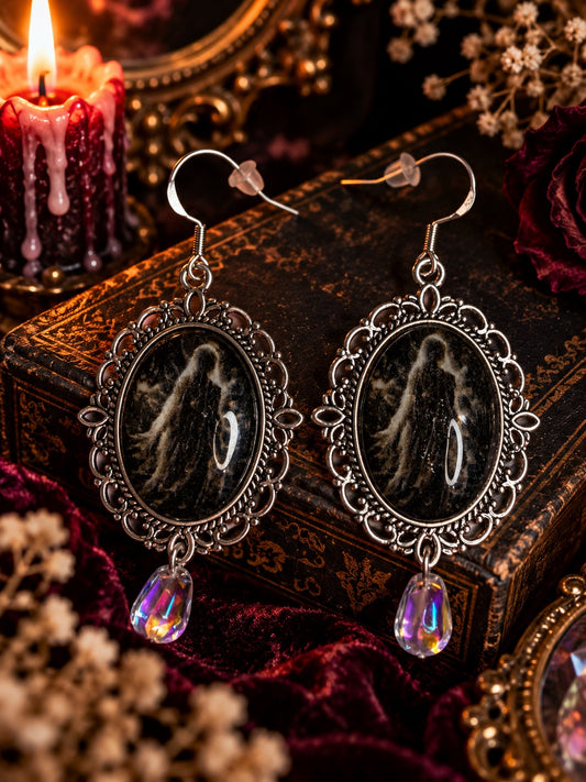 Veil of the Unknown horror cameo earrings with 925 sterling silver hooks, ornate silver-tone frames and iridescent teardrop beads.