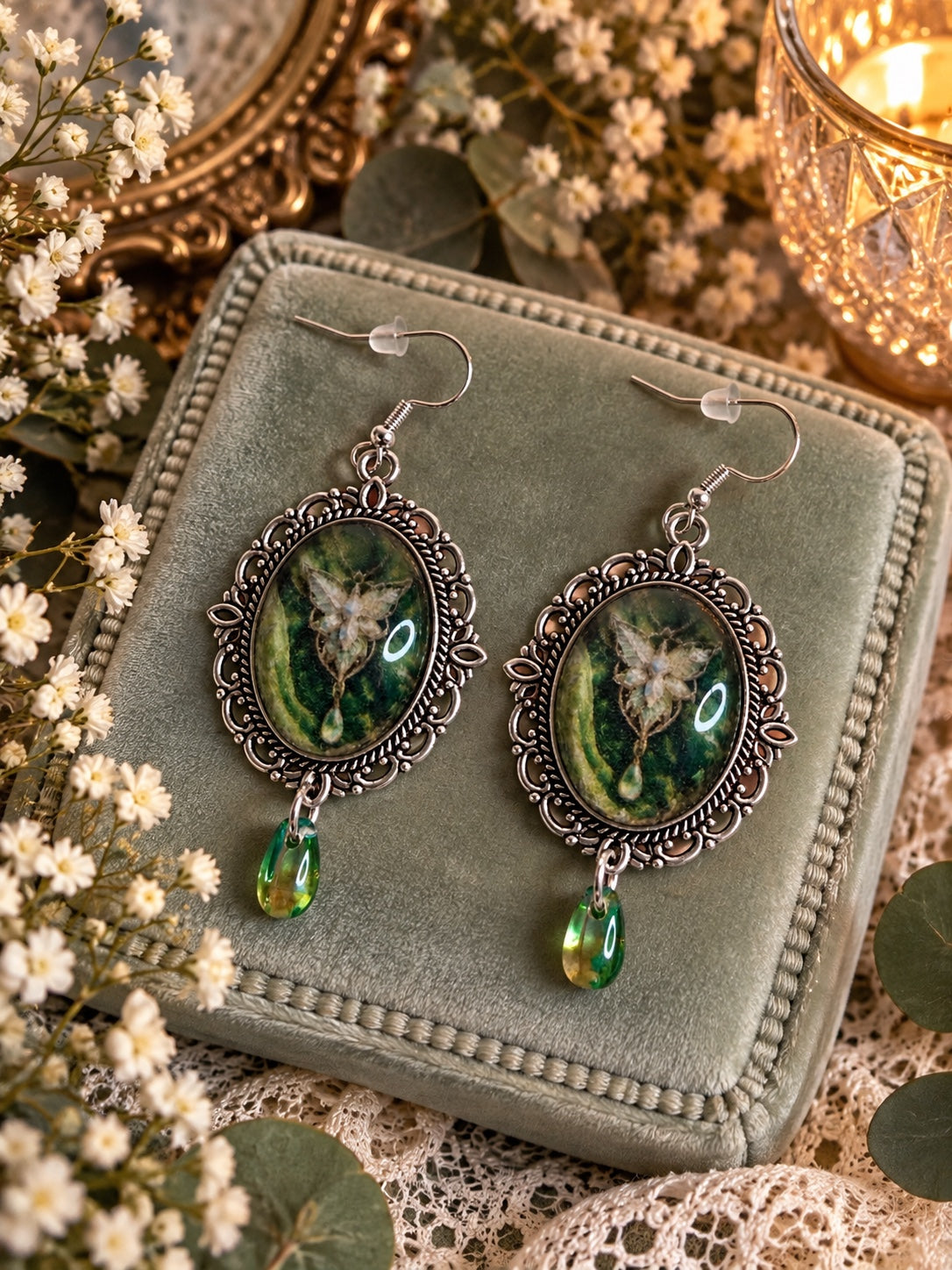 Handmade fantasy earrings with antique silver oval frames, green fairy cabochons and green teardrop charms