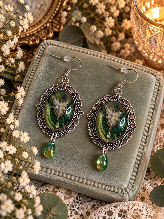 Handmade fantasy earrings with antique silver oval frames, green fairy cabochons and green teardrop charms